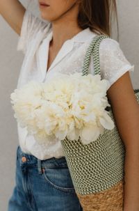 Kaboompics - Close-Up White Peony Bouquet with Eyelet Shirt and Woven Bag