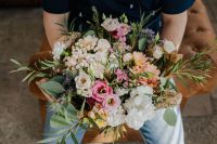 Kaboompics - Overhead View of a Man Holding a Colorful Bouquet with Both Hands
