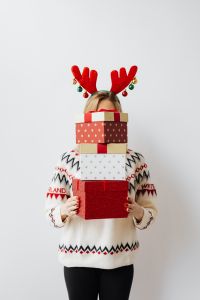 Kaboompics - Woman Carrying a Tall Stack of Christmas Presents