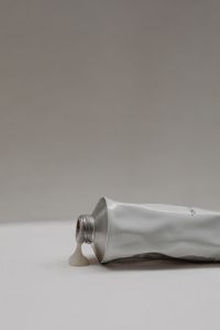 Kaboompics - Hand and Body Scrub Tube on Neutral Surface