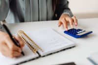 Kaboompics - Close-Up of Notebook and Calculator on a Work Desk