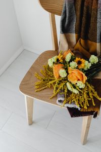 Kaboompics - Autumn Flowers and Plaid Blanket on Wooden Chair