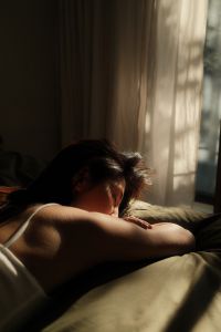 Kaboompics - Woman Sleeping in a Dark Cozy Bedroom
