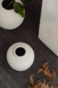 Kaboompics - Green Leaves in Textured White Vase with Neutral Ceramic Decor