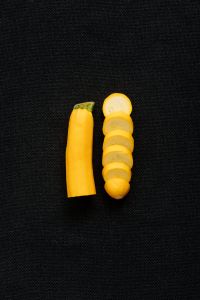 Kaboompics - Sliced Yellow Zucchini on a Black Background