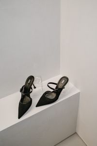 Kaboompics - Black Pointed Slingback Heels in Minimal Interior