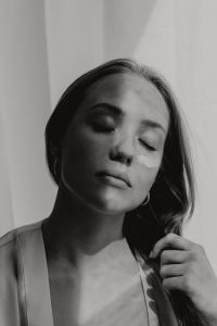 Kaboompics - Black-and-White Beauty Portrait with Eye Cream Under the Eye