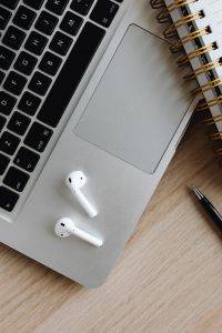 Kaboompics - Close-Up of Laptop Keyboard, AirPods and Pen