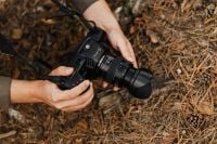 Kaboompics - Overhead View of Person Holding Cinema Camera Outdoors