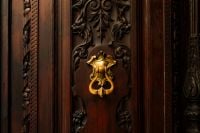 Kaboompics - Ornate Wooden Door and Brass Knocker in Malaga