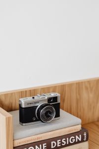 Kaboompics - Vintage Camera in a Wooden Shelf Niche with Neutral Copy Space
