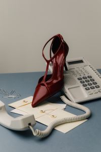Kaboompics - Red High Heels On Office Desk With Retro Telephone Minimal Composition