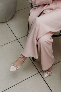 Kaboompics - Pink Satin Trousers with Embellished Bow Heels