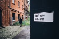 Kaboompics - Doors with a writing with a woman in the background