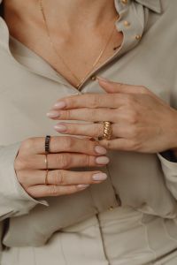 Kaboompics - Woman Wearing Gold Rings and Pendant Necklace