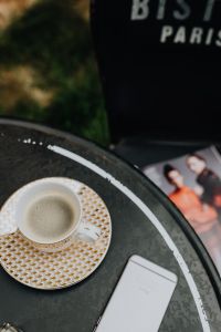 Kaboompics - Top view of table with coffee, mobile hone and magazine