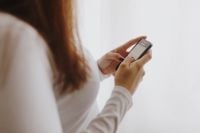Kaboompics - Beautiful young woman using smartphone