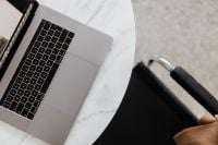 Kaboompics - MacBook Pro 15 laptop and iPhone 11 Pro on a marble table