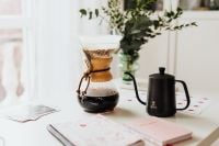 Kaboompics - Chemex Coffee Maker and Black Kettle Beside Journals on a Desk