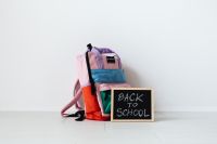 Kaboompics - Close Up of Colorful Backpacks and School Sign