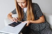 Kaboompics - Student Taking Notes with Blue Pen