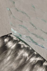Kaboompics - Vertical Glass Panel Edge Casting a Shadow on Textured Surface