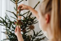 Kaboompics - Hands Hanging Red and Green Christmas Ornament