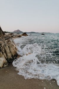 Kaboompics - Sea Foam and Dark Rocks in Close-Up, Abstract Coastal Background for Creative Projects