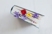 Kaboompics - Purple and Yellow Flowers Resting on a Closed Book for Spring Still Life Photography