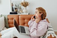 Kaboompics - Woman Taking a Phone Call While Working on Laptop