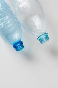 Kaboompics - Two Clear Plastic Bottle Necks in Soft Focus