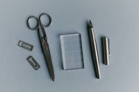 Kaboompics - Organized Paper Craft Tools on Powder Blue Background
