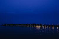 Kaboompics - City lights reflected in the water at night