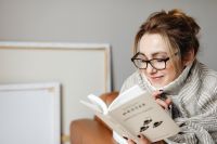 Kaboompics - Stay-at-Home Reading: Woman in Glasses with a Book