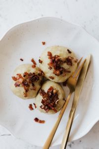 Kaboompics - Close-Up of Meat-Filled Polish Pyzy Served on a White Plate