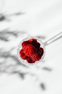 Kaboompics - Overhead Close Up Of Raspberries In Glass