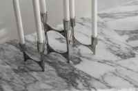 Kaboompics - Chrome Candelabra Close-Up on Arabescato Marble
