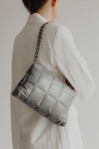 Kaboompics - Woman Seen from Behind Carrying Gray Quilted Shoulder Bag with Chain