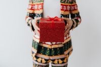 Kaboompics - Close up of man wearing a Christmas suit and hand holding red box