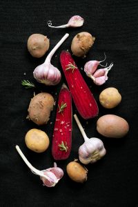Kaboompics - Garlic, Potatoes and Red Beets on a Dark Background