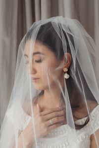 Kaboompics - Soft Bridal Makeup With Nude Lips and Pearl Drop Earrings