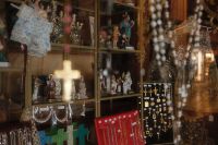 Kaboompics - Religious Souvenir Shop Window with Figurines and Crosses