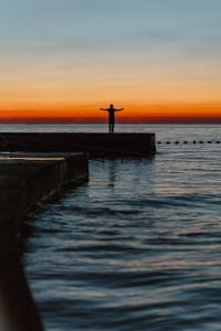 Kaboompics - The man is looking at the sunset by the sea