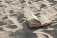 Kaboompics - Open Book Resting on Sunlit Ripples of Beach Sand