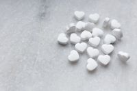 Kaboompics - White Candy Hearts Minimalist Background