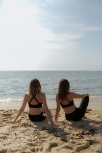 Kaboompics - Two Women Sitting by the Ocean