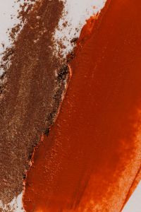 Kaboompics - Orange Lipstick and Brown Powder Texture