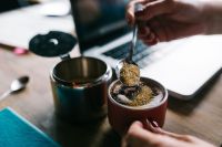 Kaboompics - Woman pours sugar into coffee