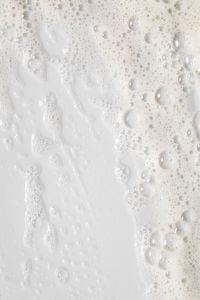 Kaboompics - Bright White Cleanser Foam Texture with Fine and Medium Bubbles, Skincare Macro