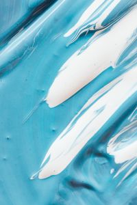 Kaboompics - Broad White Paint Streaks Across a Cool Blue Surface
